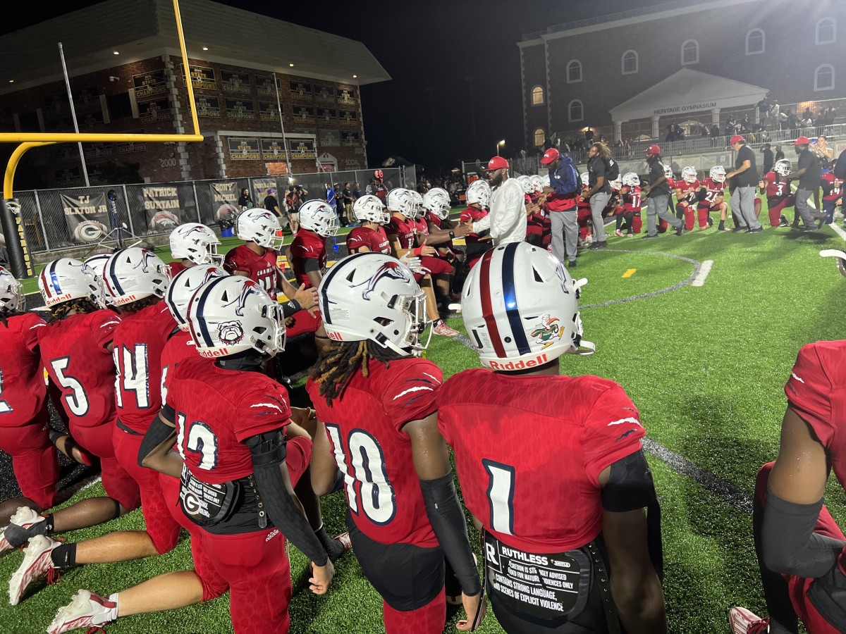 Chaminade-Madonna head coach Dameon Jones addresses his squad after the Lions topped American Heritage in South Florida on Friday night.